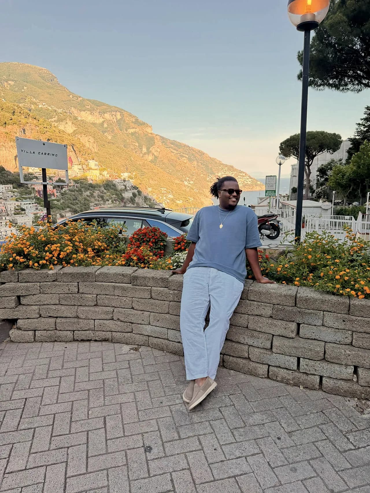 Negus on the Amalfi Coast at golden hour, Positano below.